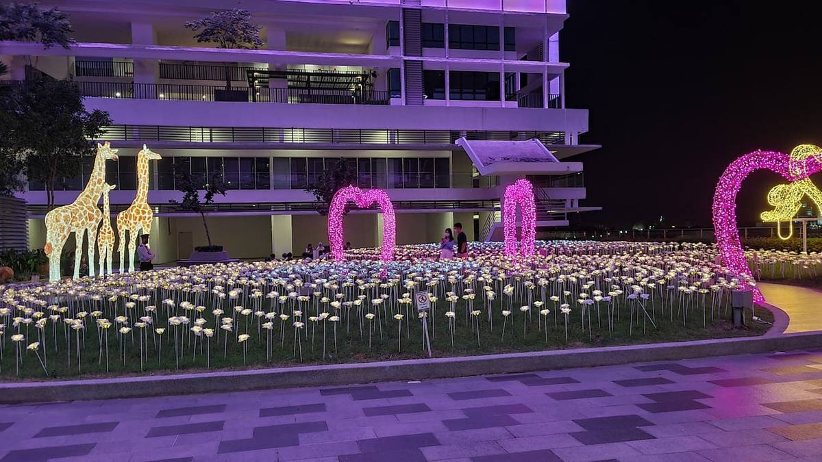 The City of Digital Lights at i-City after dark, with illuminated sculptures along the walkways.